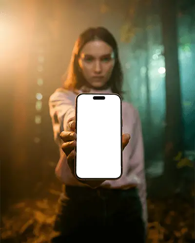 Woman Holding Iphone 15 Mockup In Forest Background Blank Screen Smartphone Display