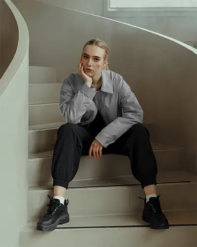 Relaxed Urban Fashion Outfit Women Jacket Mockup Pant Sitting On Steps Contemporary Style