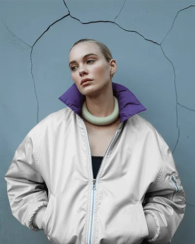 Womens Bomber Jacket Mockup Fashion Model Against Textured Wall Modern Editorial Style