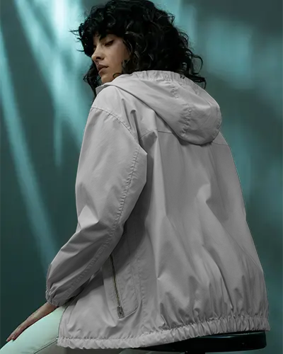 Urban Back View Jacket Mockup Female Model Standing Casually With Soft Depth And Editorial Street