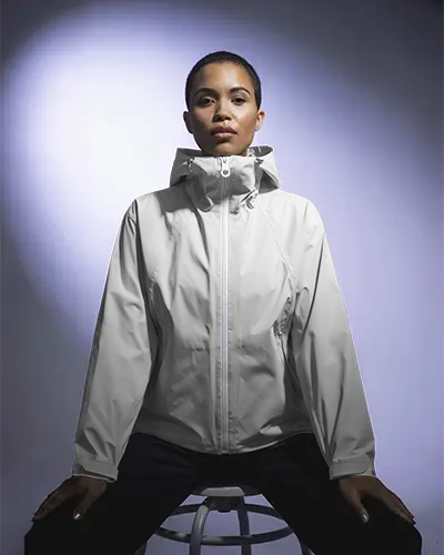 Minimal Studio Jacket Mockup Female Model Seated Front View With Balanced Light And Modern Fashion