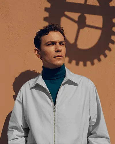 Outdoor Bomber Acket Mockup Male Model Looking Away Sunlit Wall Strong Shadow Fashion Style