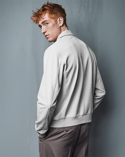 stylish-back-view-jacket-mockup-male-model-with-red-hair-posing-in-moody-soft-lighting-028