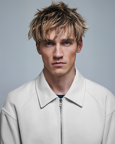 close-up-studio-jacket-mockup-male-model-with-messy-blonde-hair-wearing-white-zip-up-jacket-against-light-grey-background-modern-and-edgy-look-033