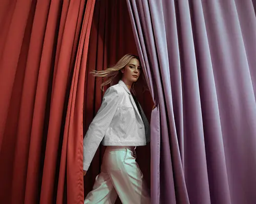 Modern Studio Jacket Mockup Female Model Walking Through Colorful Curtains Stylish Look