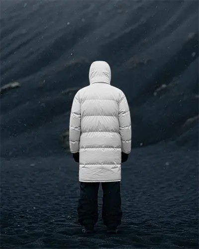 Shadow Dunes Long Puffer Jacket Mockup Hooded Figure Standing In Dark Windy Landscape