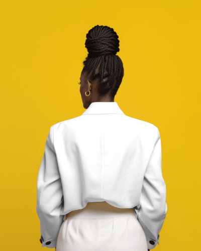 back-view-of-black-woman-wearing-a -jacket-in-front-of-yellow-screen