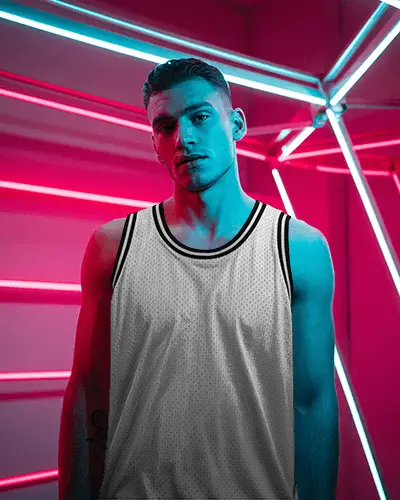Neon Arena Jersey Mockup With Athlete Framed By Bold Pink And Blue Light Tubes
