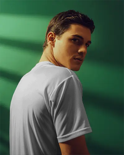 Modern Portrait Jersey Mockup Male Model In Warm Light Against Green Backdrop