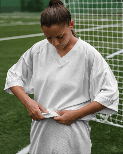 Dynamic Sports Jersey Mockup Female Soccer Player On Green Field With Vibe Graphic