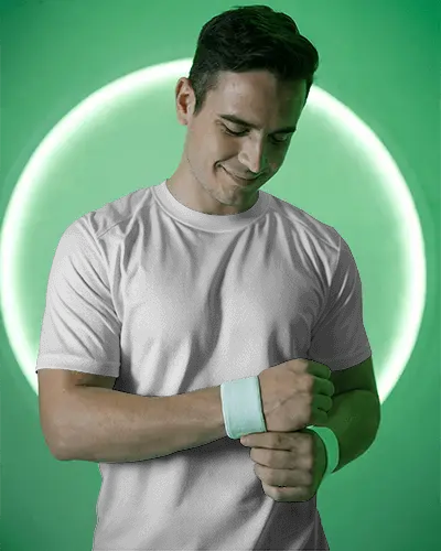 Fresh Look Male Model In White T Shirt With Placeholder Design Adjusting Wristband In Modern Lighting