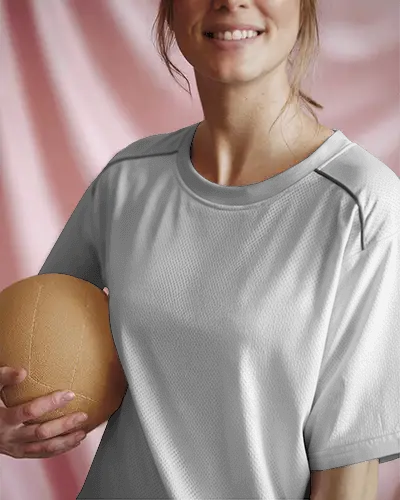 Smiling Woman In Sporty Jersey Holding Volleyball Soft Pink Background Front Logo Design Highlight