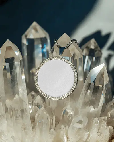circular-pendant-necklace-mockup-showcased-on-glasses-with-glistening-highlights-and-shadows