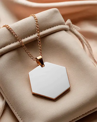 hexagonal-gold-pendant-mockup-displayed-over-beige-jewelry-pouch-on-satin-drape-soft-lighting-luxury