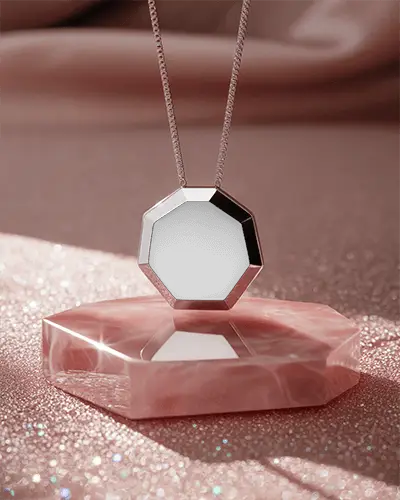 octagonal-silver-necklace-mockup-hanging-above-pink-gemstone-background-with-smooth-lighting