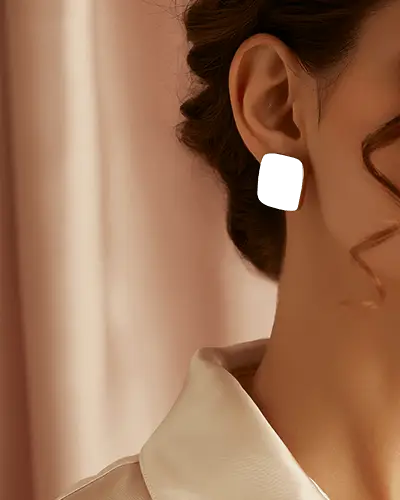 Close Up Earring Mockup On Female Model With Curled Hair And Soft Pink Curtain Background