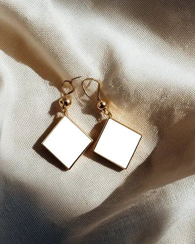 Sunlit Golden Drop Earring Mockup On Creased Luxury Fabric With Textured Cloth Highlights