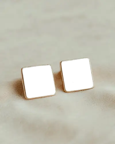elegant-square-stud-earring-mockup-with-black-center-on-soft-beige-textured-fabric