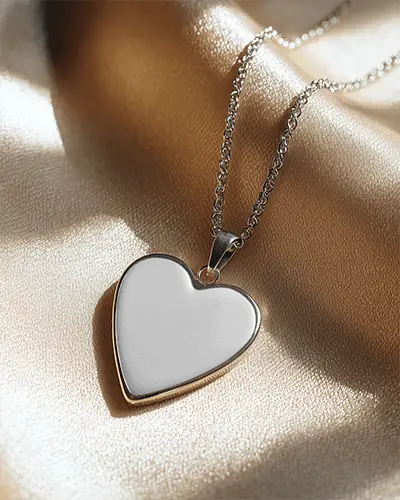 delicate-heart-locket-necklace-mockup-with-intricate-chain-laying-on-smooth-textile