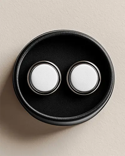 round-earring-mockup-with-minimalist-sleek-metallic-edge-on-leather-presentation