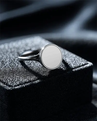 elegant-minimalist-round-ring-mockup-on-dark-fabric-with-smooth-surface-for-personalized-logo