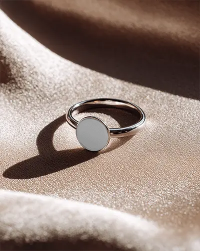 sleek-simple-round-ring-mockup-displayed-on-luxurious-ruffled-fabric-for-branding