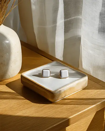 minimalist-square-earring-mockup-on-ceramic-tray-with-natural-light-and-soft-textured-background