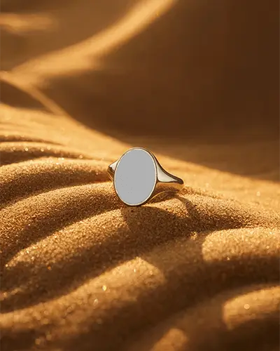Elegant Minimalist Oval Ring Mockup On Textured Sand Background For Jewelry Brand Display