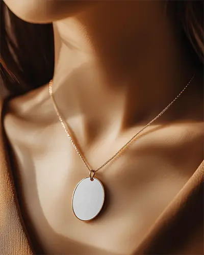 Elegant Pendant Necklace Mockup Oval Metal Frame On Female Skin In Golden Hour Lighting