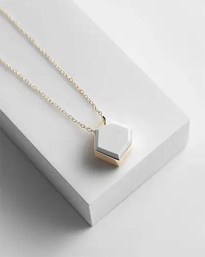 hexagonal-necklace-mockup-flat-lay-view-on-angled-podium-in-clean-light-setting