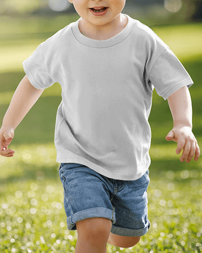 Cheerful Kid T Shirt Mockup Happy Child Running In Bright Casual Tee And Denim Shorts On Green Lawn Playful And Energetic Outdoor Look