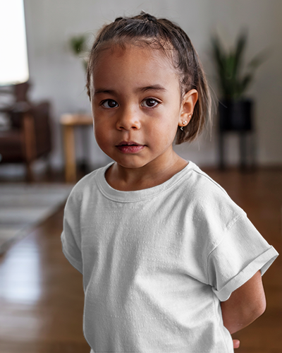 Charming Kid T Shirt Mockup Little Girl In Stylish Rolled Sleeve Tee Standing In Cozy Home Setting Casual And Confident Look