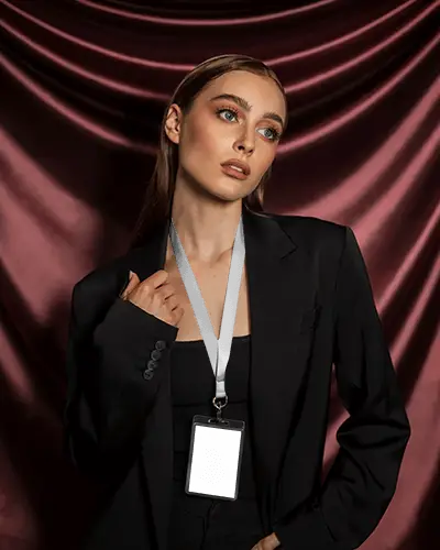 Premium Lanyard Mockup Female Model In Dark Suit With Silky Maroon Curtain Background