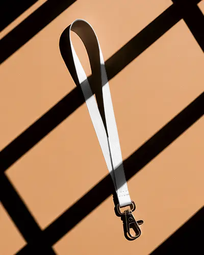Minimalist Lanyard Mockup On Peach Background With Dramatic Window Light And Shadows