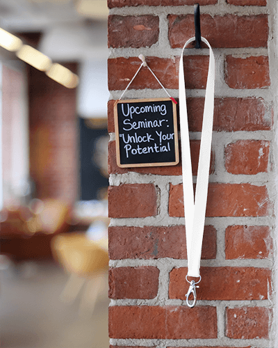 Lanyard Mockup With Metal Clip On Brick Wall Next To Seminar Sign Cozy And Professional Event Setting 035