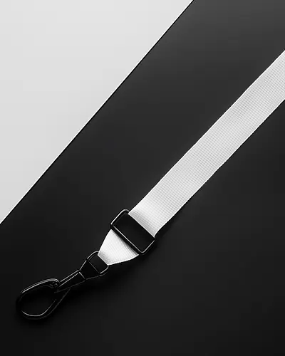 White Fabric Lanyard Mockup With Black Metal Clip Diagonal Layout On Minimal Black And White Background Clean And Modern Presentation