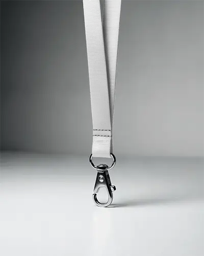Minimal Lanyard Mockup Hanging Front View On Clean Surface With Metal Clip And Soft Lighting
