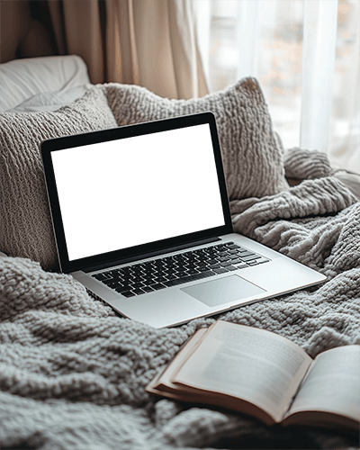 Cozy Bedroom Laptop Mockup Soft Knit Blankets Open Book Serene And Relaxed Atmosphere 074