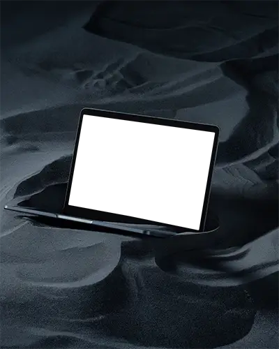 Macbook Air M1 Mockup Partially Submerged In Black Sand Dunes With Soft Contours And Deep Shadows Minimal And Mysterious Atmosphere