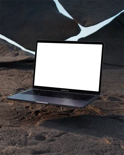Macbook Air M1 Mockup Floating Over Cracked Desert Ground With Glowing Crevices Evening Light And Rugged Terrain Contrast