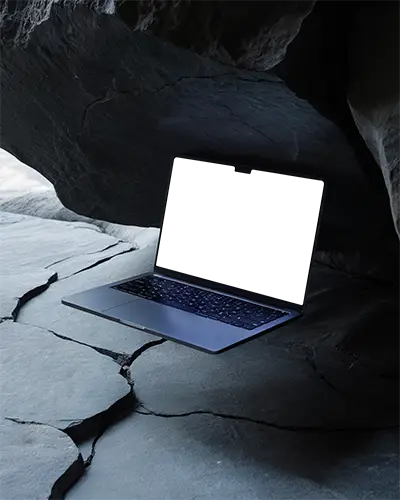 Macbook M1 Pro Mockup Floating Between Dark Slate Rocks And Light Cracks In Shadowy Cavern Environment Cool And Mysterious Composition