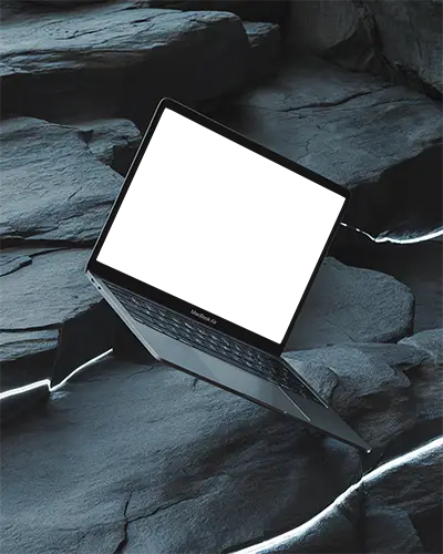 Macbook Air M1 Mockup Angled Over Cracked Slate Rocks With Glowing Light Veins And Cool Toned Textures Futuristic And Dramatic Look