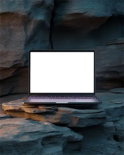 Macbook Air M1 Mockup Resting On Layered Canyon Rocks With Warm And Cool Contrast Lighting Natural And Balanced Scenic Style
