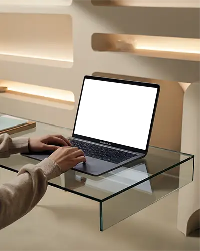 Macbook Air M1 On Glass Desk With Hands Typing Minimalist Interior Background Modern Lighting