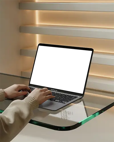 Macbook Air M1 On Glass Table Hands Typing Warm Lighting Modern Interior Horizontal Shelves