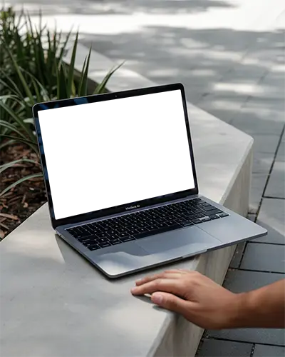 Macbook Air M1 Outdoor Concrete Bench Sidewalk Hand Resting Urban Greenery