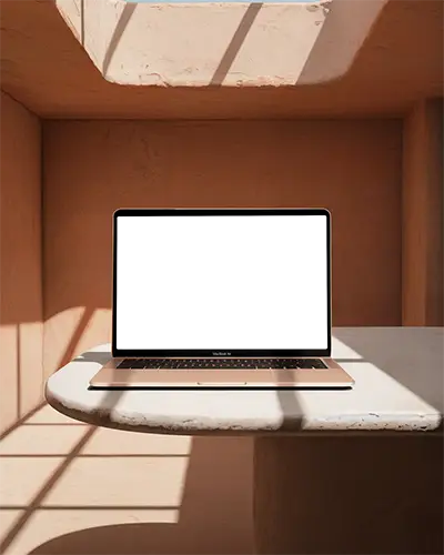 Macbook Air M1 Mockup In Sunlit Earthy Niche With Textured Walls Marble Table Soft Natural Light Minimalist Warm Tones