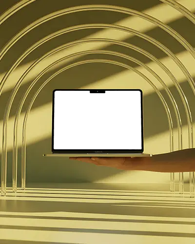 Golden Arches Macbook Air M3 Mockup Held By Hand In Abstract Sunlit Studio Space