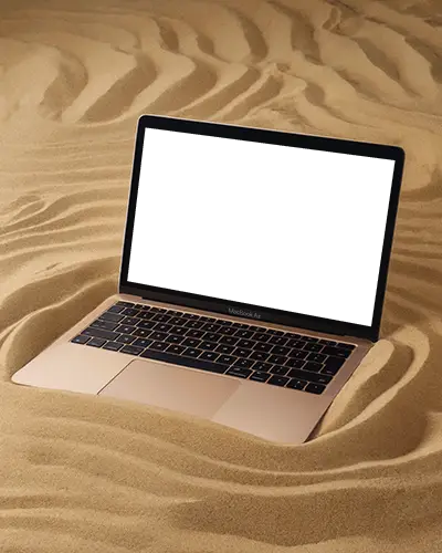Macbook M1 Air Mockup Partially Buried In Smooth Sand With Natural Dune Texture