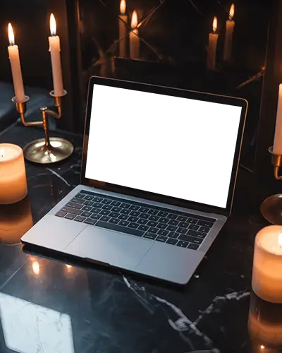 Macbook M1 Pro Mockup On Black Marble Surface Surrounded By Glowing Candles